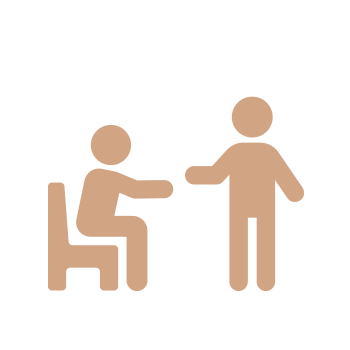 An icon depicting a conversation between two figures, one seated in a wheelchair and the other standing, with a speech bubble indicating verbal interaction.